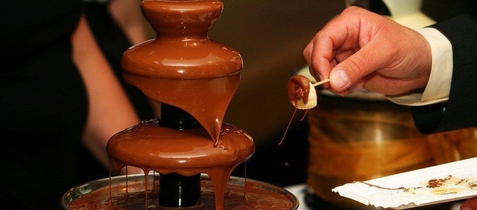 unforgettable weddings, unconventional weddings, wedding theme ideas, chocolate fountains, cheese sclupture, chair bows