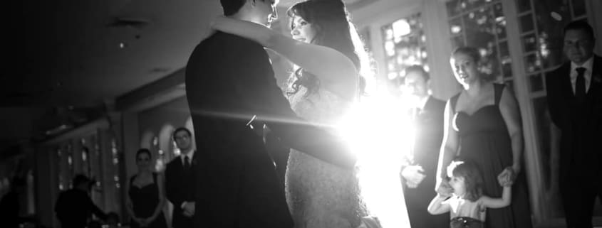 Bride and groom dancing at an elegant Fairfield wedding reception with DJ lighting