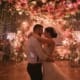 Wedding couple dancing as DJ sets the mood for a memorable moment