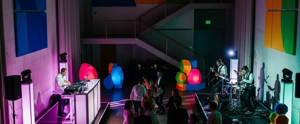 Wedding DJ and live band performing side by side at an upscale reception