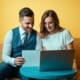 Engaged couple planning wedding DJ booking timeline